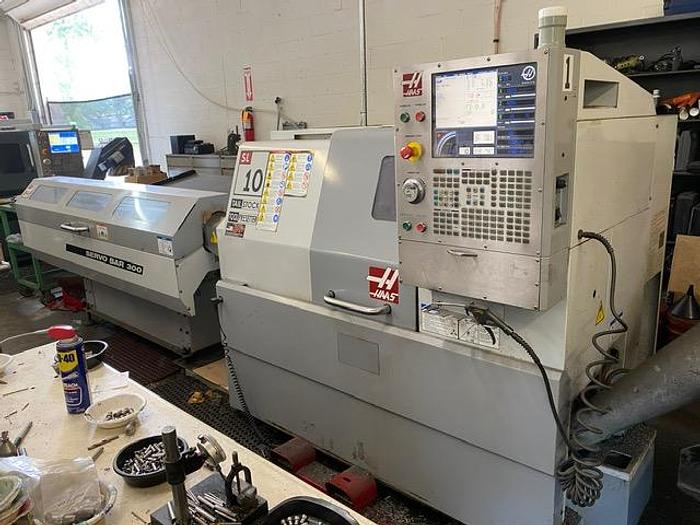 Used 2007 Haas CNC Lathe SL-10T & Servo Bar 300 Feeder