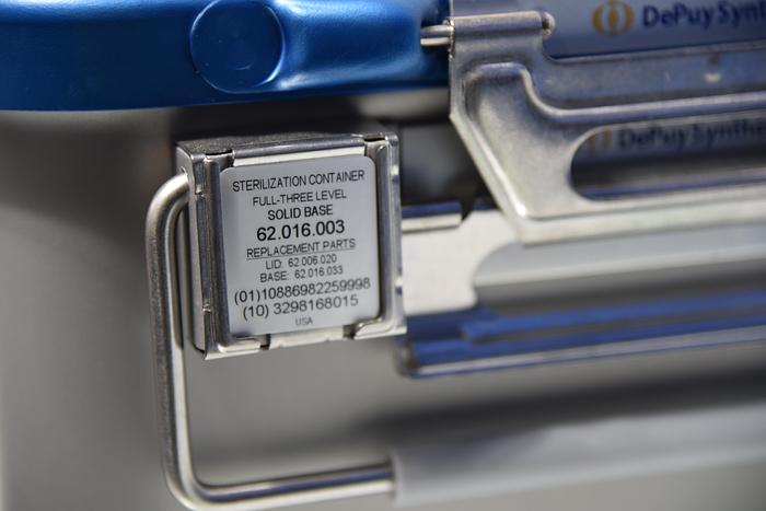 Used DEPUY SYNTHES 62.016.003 STERILIZATION CONTAINER FULL-THREE LEVEL SOLID BASE 