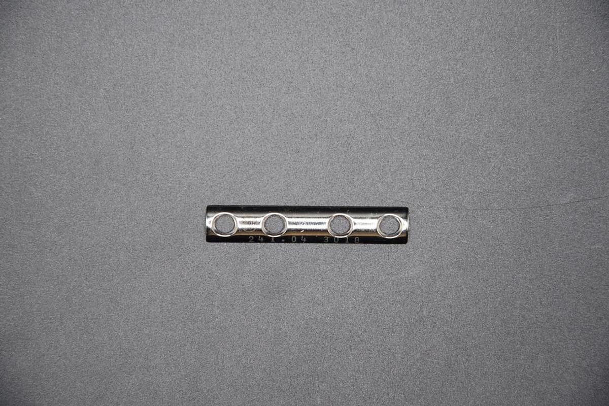 Used SYNTHES 241.04 STAINLESS STEEL TUBULAR PLATE, 1/3 SIZE, 49MM LENGTH, 4 HOLES