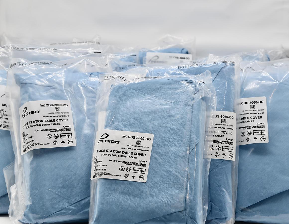 Used Pedigo CDS-3060 Space Station Central Supply Work Table and Pedigo CDS-3060-DD Space Station Table Cover