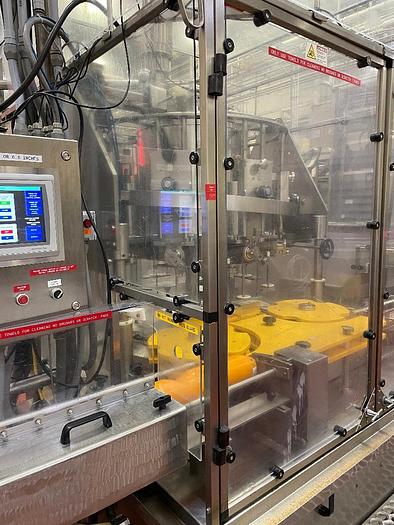 Used Cozzoli Model RFP-8 8 Head Rotary Filler with McBrady Model 200 Bottle Cleaner