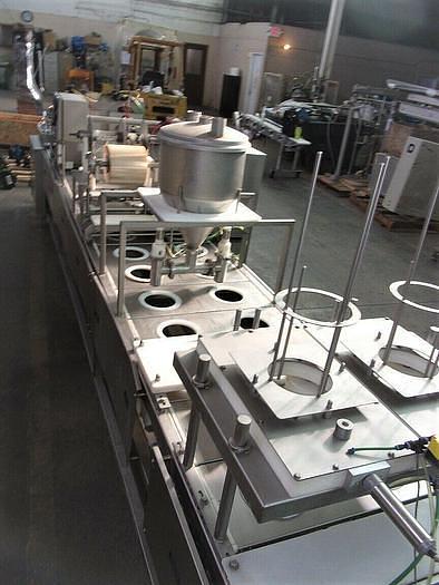 Used PMR Model 1300 Dual Lane Continuous Container Filler Sealer Lidder Stainless Steel Sanitary