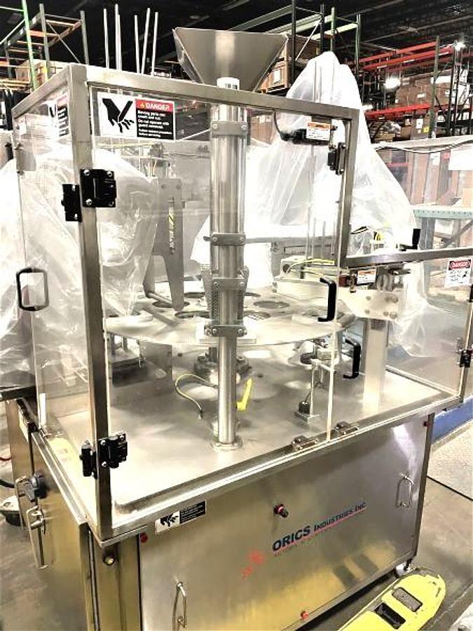 Used Orics Model R50 Rotary Cup/Tub Filler Sealer and Lidder