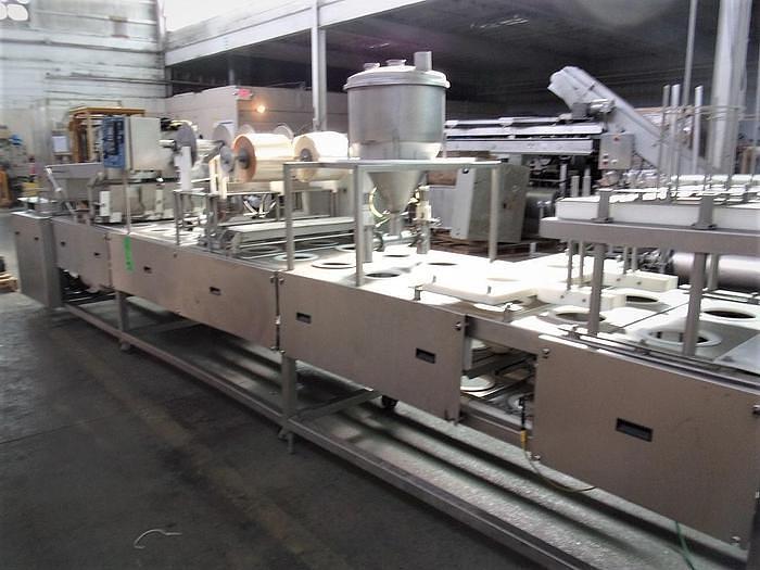 Used PMR Model 1300 Dual Lane Continuous Container Filler Sealer Lidder Stainless Steel Sanitary