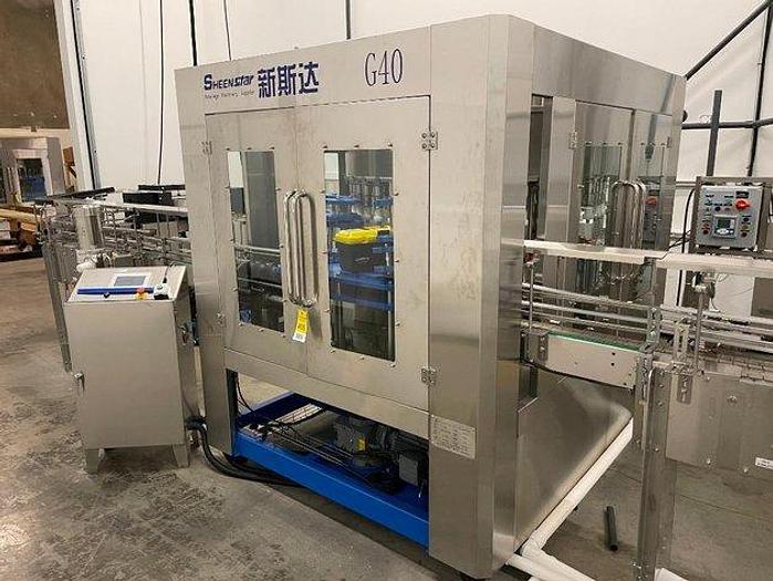 Used Sheenstar Model G40 Gravity Filler Machine