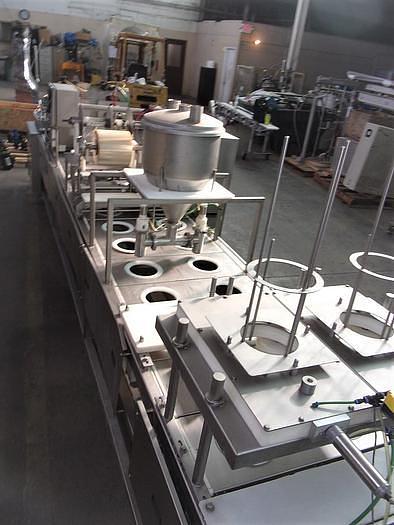 Used PMR Model 1300 Dual Lane Continuous Container Filler Sealer Lidder Stainless Steel Sanitary