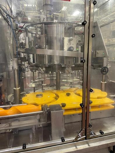 Used Cozzoli Model RFP-8 8 Head Rotary Filler with McBrady Model 200 Bottle Cleaner