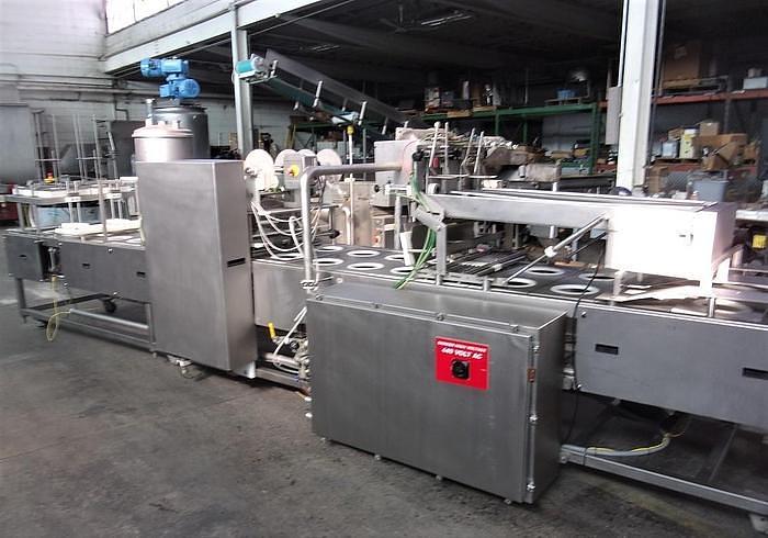 Used PMR Model 1300 Dual Lane Continuous Container Filler Sealer Lidder Stainless Steel Sanitary