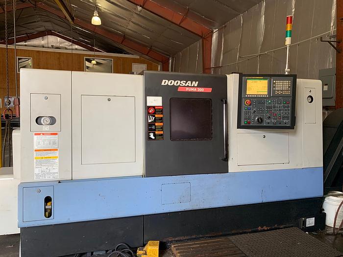 2014 Doosan Puma 300C with 4" Hole