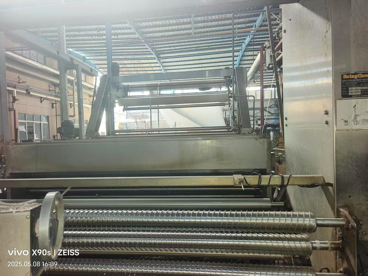 Used Hsing Cheng slitting machine for fabric