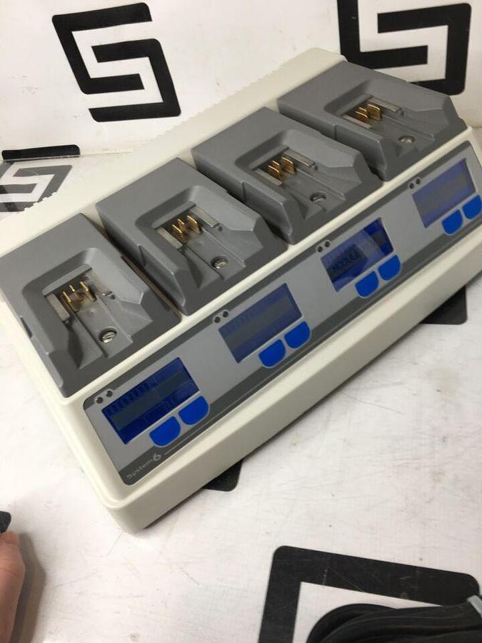 Used 611120 System W/ 4 Charging Bays TESTED