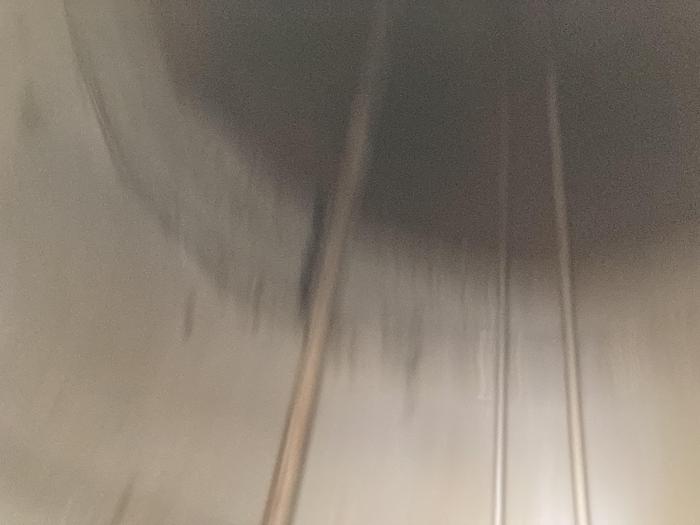 Used Used Wolfe Mechanical 20,000 gallon 304 stainless steel vertical storage tank. 