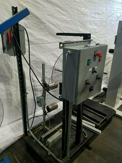Used Rapid Motorized Double Sided Stock Reel Material Feed with control panel