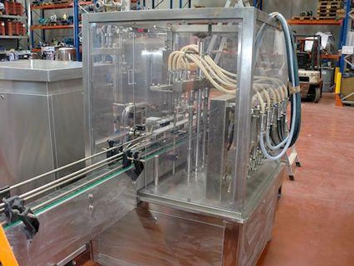 Usado Maquina dosificadora de liquidos de 6 pistones lineal marca  C-TRAK LTD