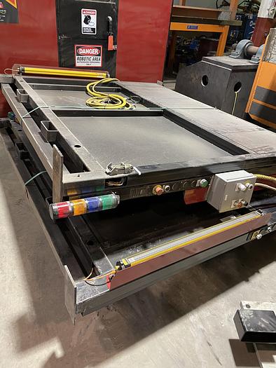 Used LINCOLN SYSTEM 55 WITH FANUC M710iC/20L TORCH CUTTING CELL WITH DUAL ROLL IN ROLL OUT TABLES