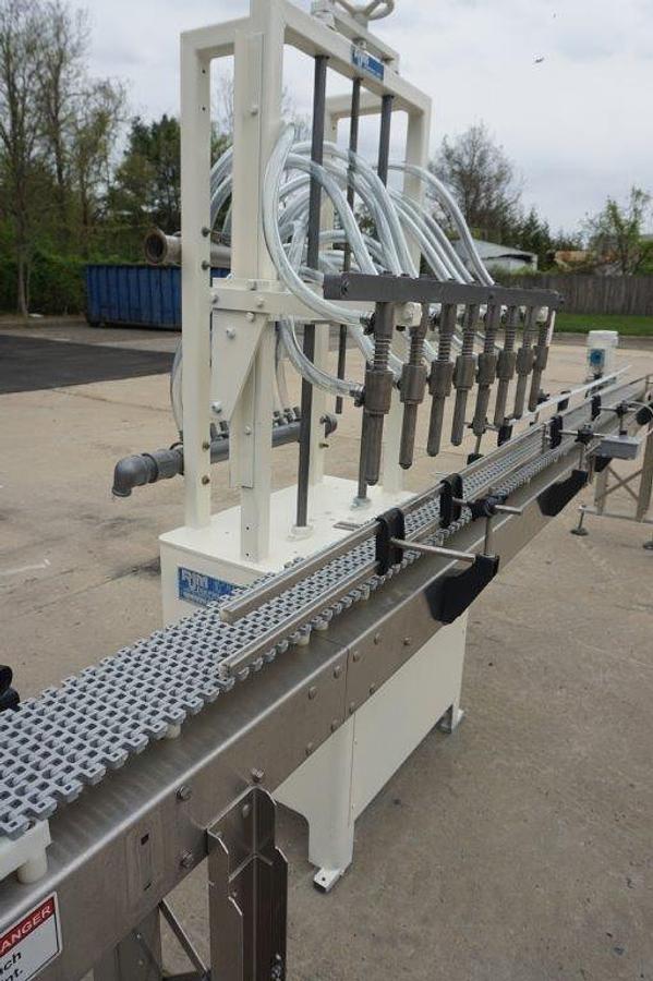 Used RJM 8 Spout Straight Line Liquid Filling Machine, Pressure Gravity Nozzles