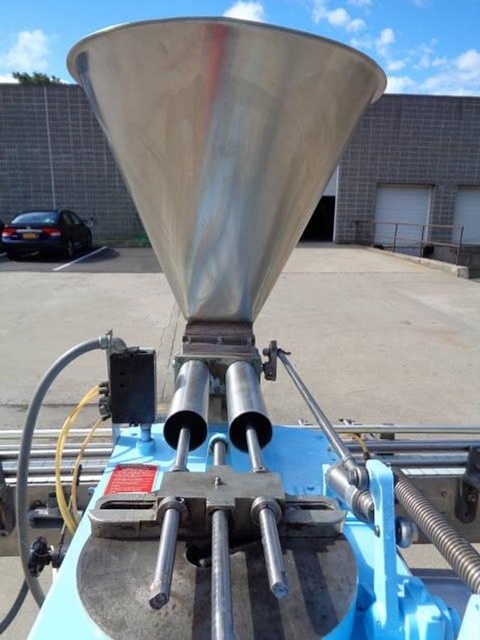 Used Simplex Twin Head Automatic Piston Filler With Indexing Conveyor