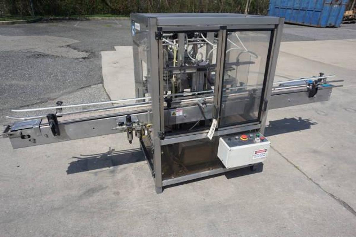 Used Biner Ellison Six Head Straight Line Piston Filling Machine