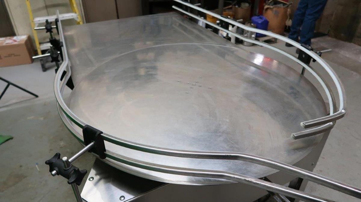 Used 40 In. Diameter E-PAK Stainless Steel Rotary Unscrambling/Accumulating Table with Shelf