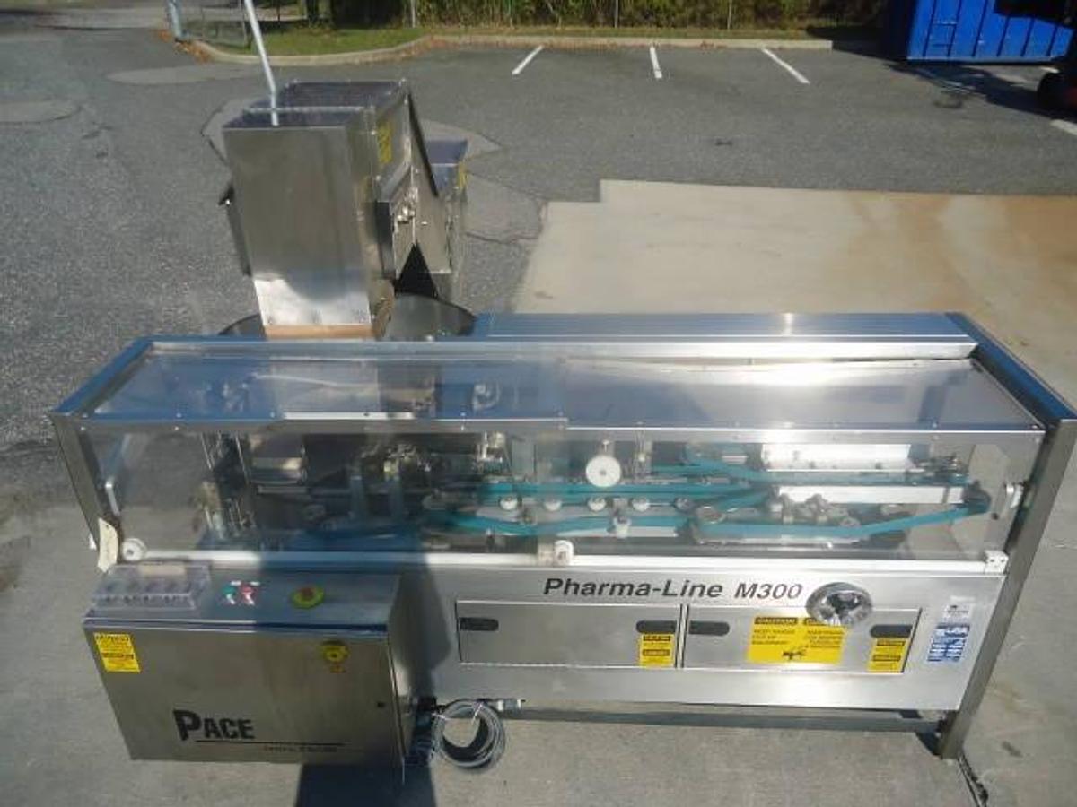 Used PACE PHARMA-LINE M300 STAINLESS STEEL PLASTIC BOTTLE UNSCRAMBLER WITH ELEVATOR