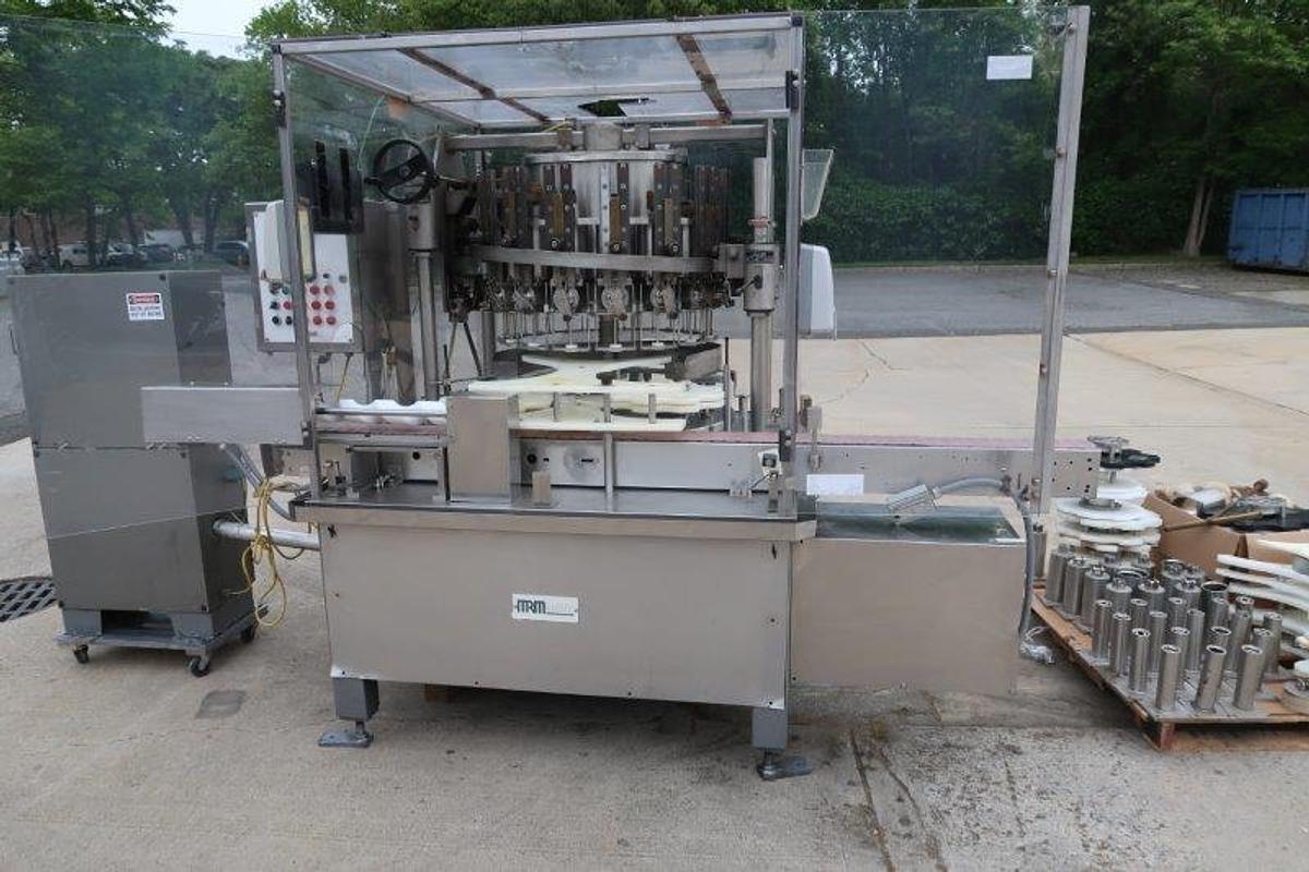 Used MRM/Elgin 16 Head Rotary Piston Filler, up to 32 Oz.