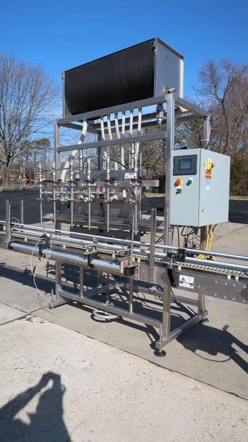 Used Apacks Six Head Automatic Sanitary Pressure Gravity Filling Machine, Expandable