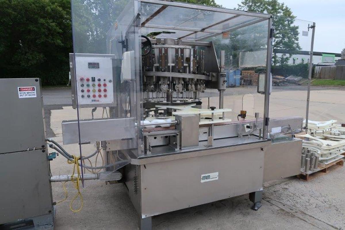 Used MRM/Elgin 16 Head Rotary Piston Filler, up to 32 Oz.