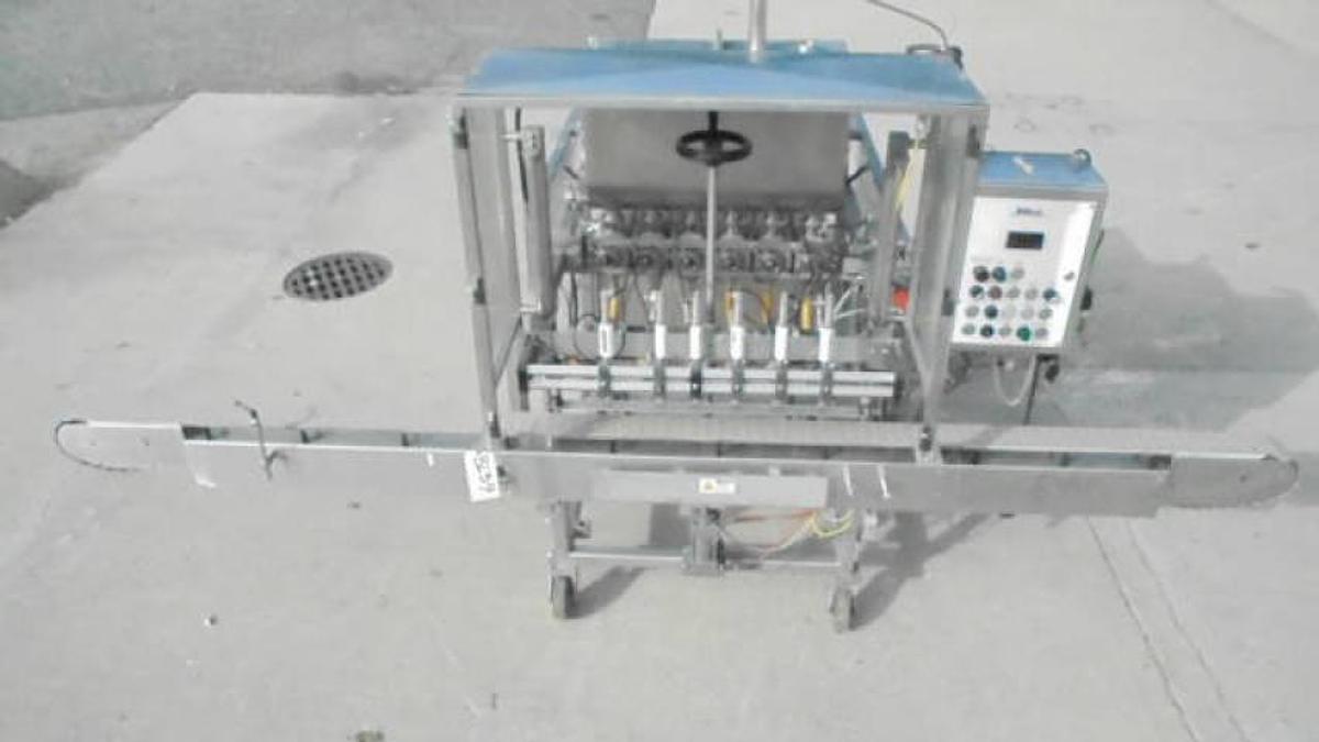 Used MRM/Elgin Six Piston Inline Filling Machine, 94 ounce pistons