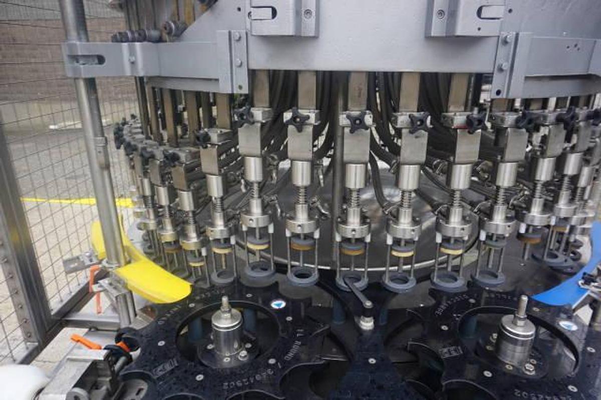 Used U.S. Bottlers 48 Valve Rotary Gravity Filling Machine, Last Filling Alcohol