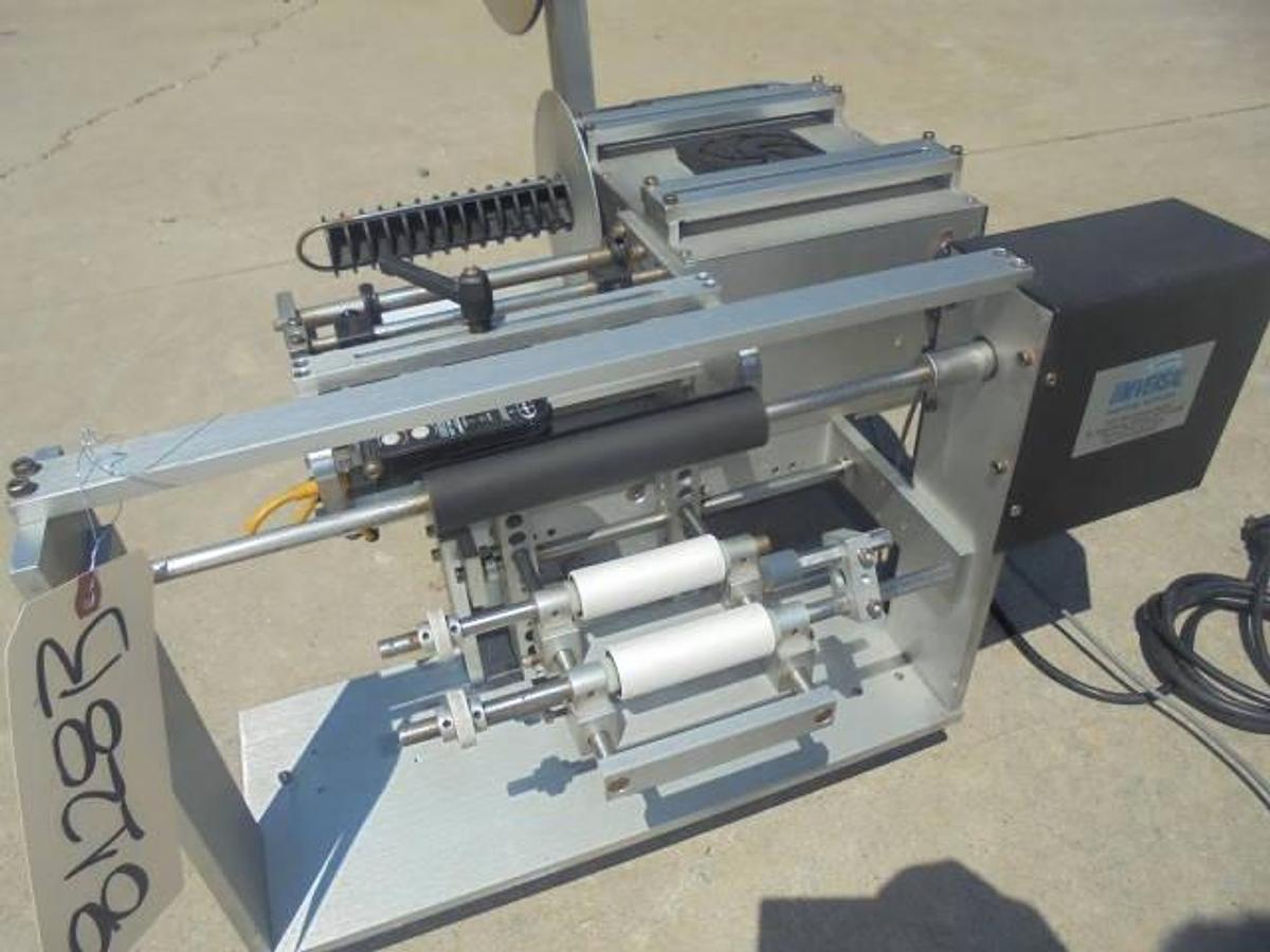 Used Universal R310 Tabletop Semi-Auto Pressure Sensitive Spot/Wraparound Labeler