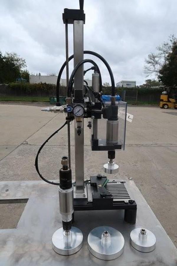 Used Kinex Air Operated Chuck Style Capper with Bench Top Table