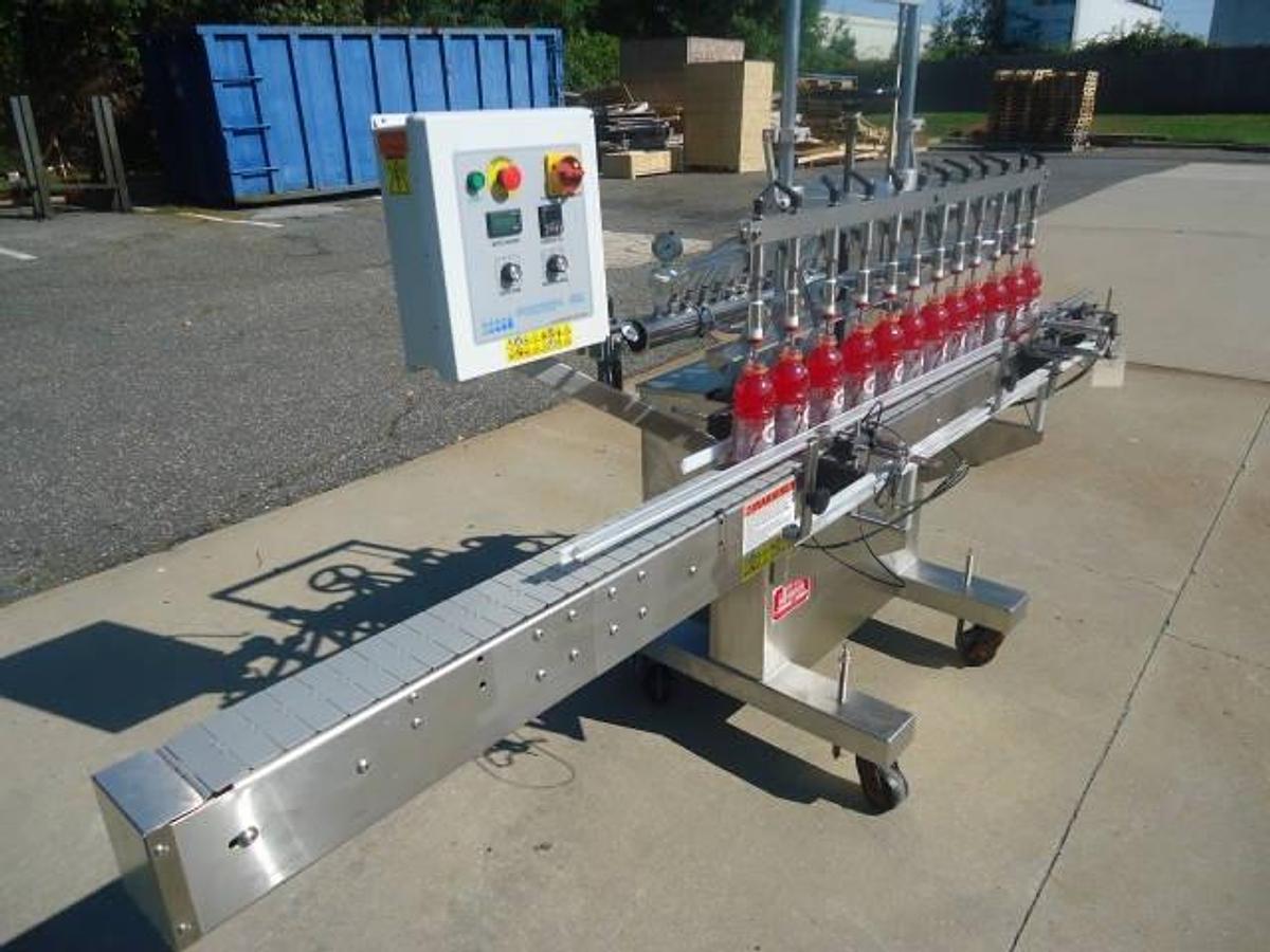 Used Kaps-All Twelve Spout Inline Pressure Filler Model Fa-P