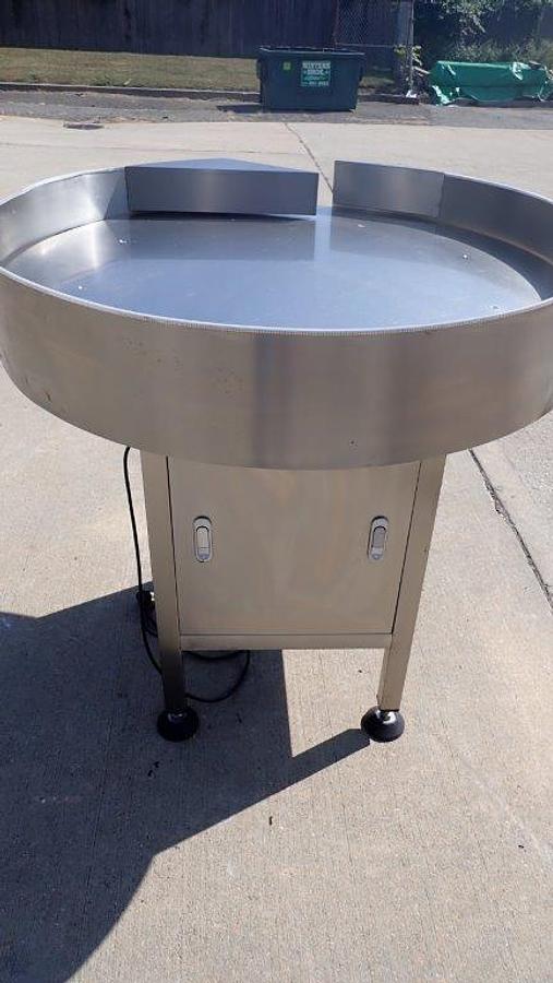 Used Metica 36 in SS Rotary Unscrambling/Accumulating Table, Varnished