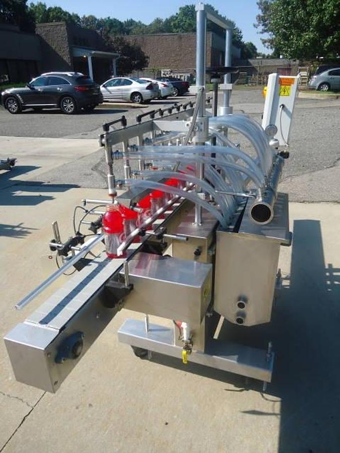 Used Kaps-All Twelve Spout Inline Pressure Filler Model Fa-P