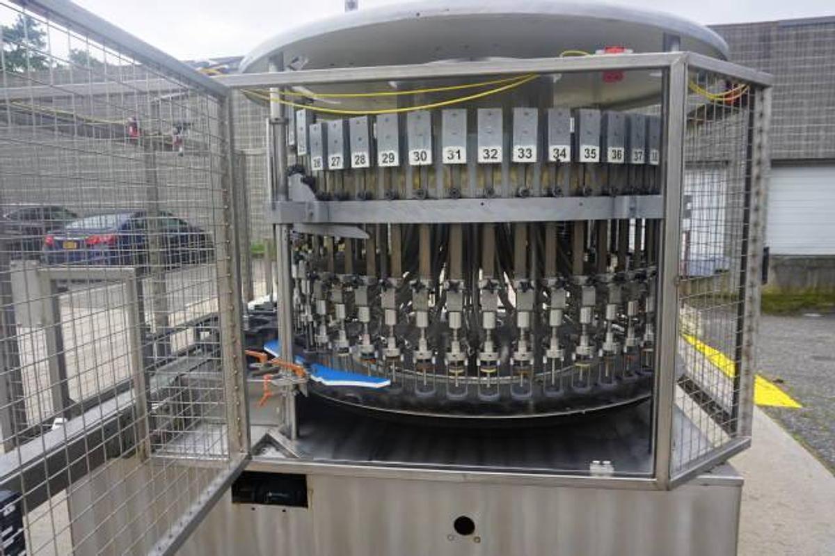 Used U.S. Bottlers 48 Valve Rotary Gravity Filling Machine, Last Filling Alcohol