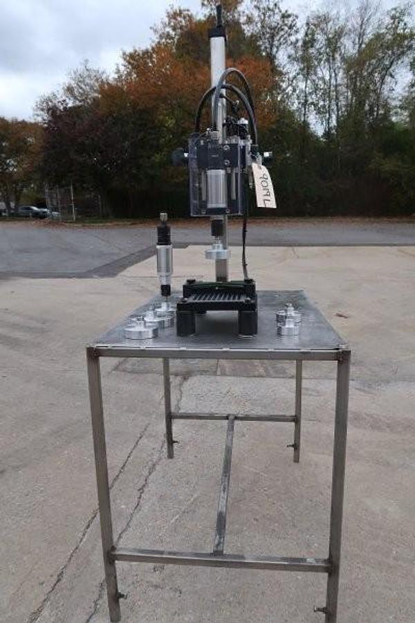 Used Kinex Air Operated Chuck Style Capper with Bench Top Table