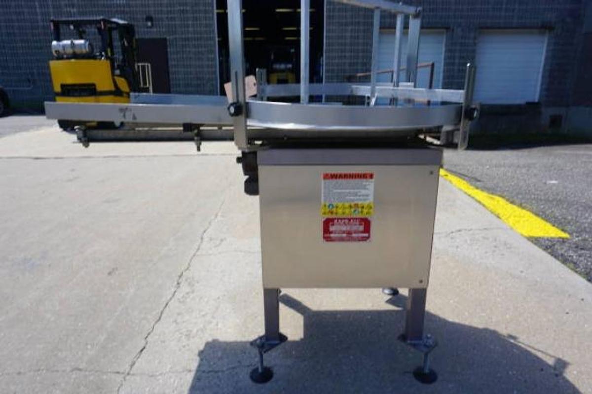 Used 36 In. Kaps-All Stainless Steel Rotary Table, with unscrambling shelf