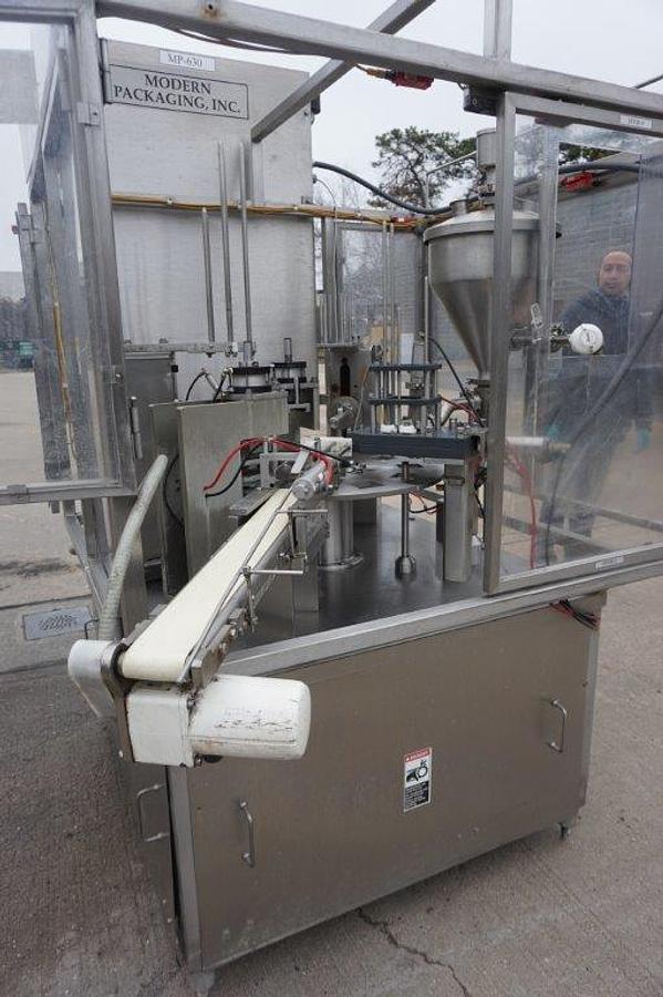 Used Modern Packaging MR Series Rotary Cup Filling and Sealing Machine