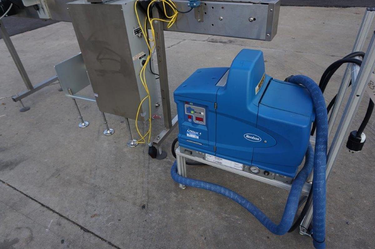 Used Creative Automation 401 Outserter, with Nordson Gluer