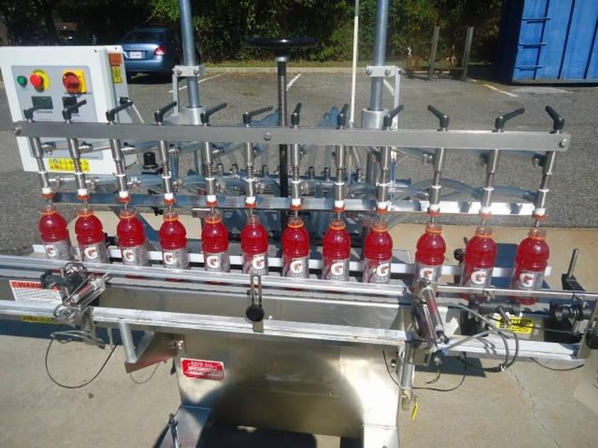 Used Kaps-All Twelve Spout Inline Pressure Filler Model Fa-P