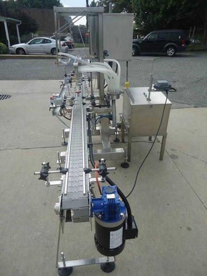 Used Filling Equipment Company Twelve Spout Straight Line Automatic Liquid Filler
