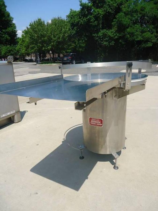 Used 36 Inch diameter Kaps All rotary unscrambling table, stainless steel base