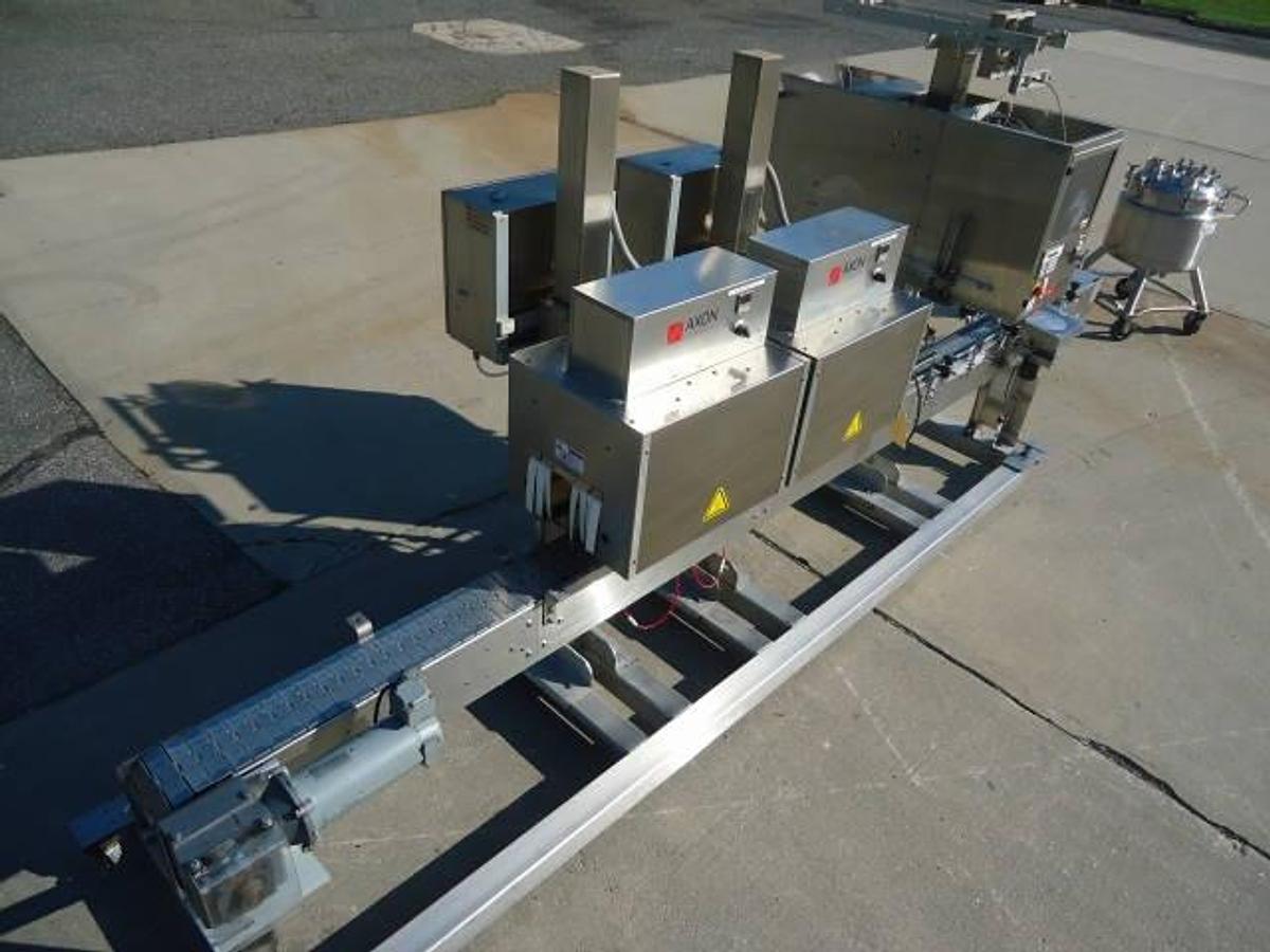 Used Axon Ez-130 Sleeving System With Twin Shrink Tunnels, 15 Ft. Conveyor