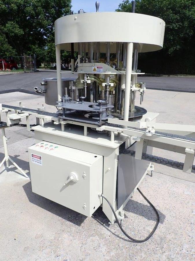Used New Way 12 Spout Rotary Pressure Gravity Liquid Filling Machine, 8-1/4 In. Centers