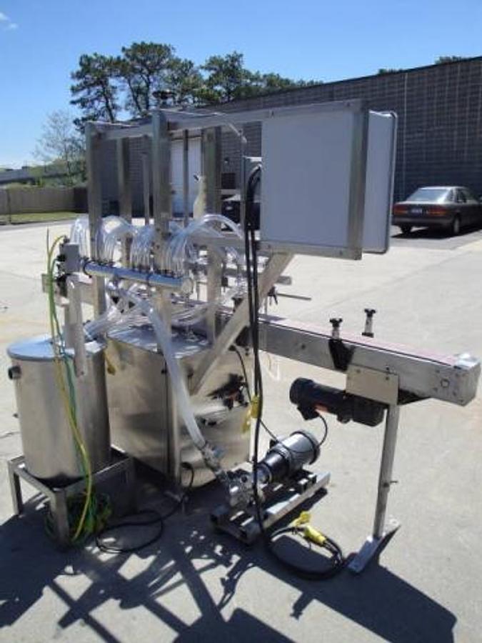 Used Packaging Dynamics Twelve Spout Stainless Automatic Liquid Filler
