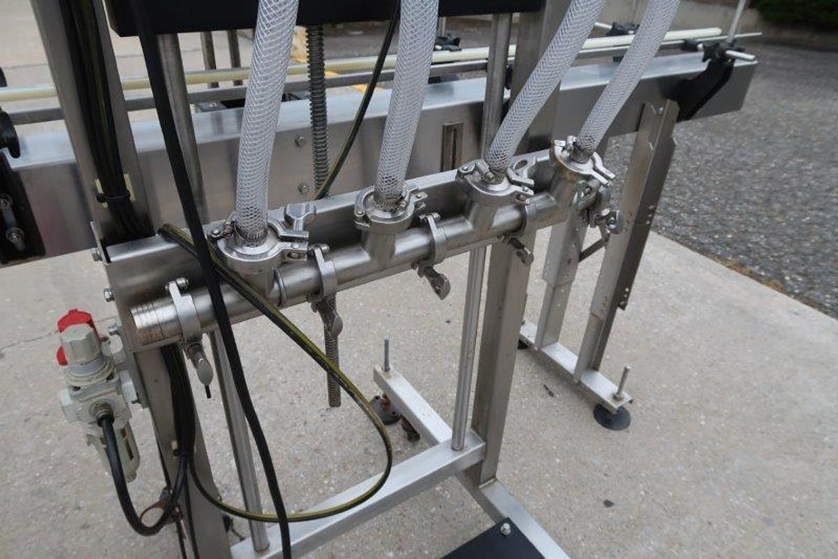 Used Apex Four Head SS Overflow Filler