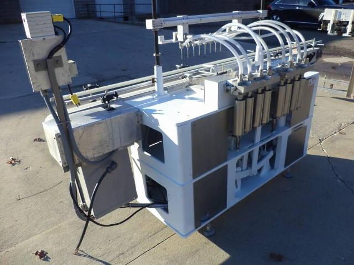 Used Cozzoli Eight Piston Straight Line Automatic Filing Machine, 240cc Pistons