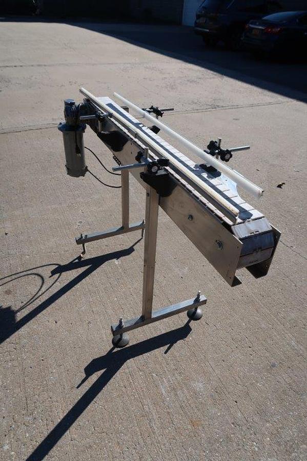 Used 4-1/2 In. Wide X 57 In. Long Motorized Bottle Conveyor, Variable Speed