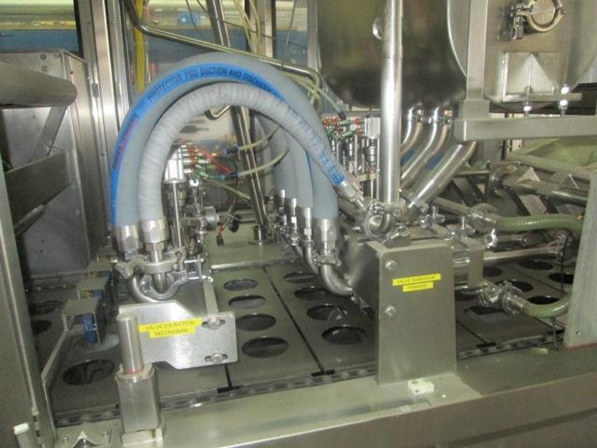Used BWI Holmatic Opti-Fil four lane cup filling line
