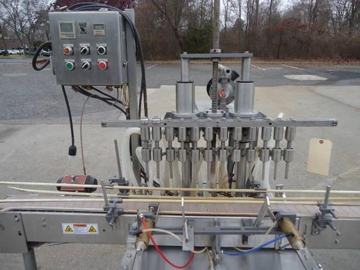Used Jg Machine Works Twelve Spout Automatic Pressure Gravity Filler